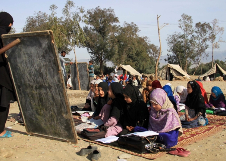 Afghan girls attend a makeshift school in the eastern city of Jalalabad in March. A sharp increase in students, particularly girls, is often cited as a success story in rebuilding the country. However, the U.S. special inspector for Afghanistan has questioned whether Afghan officials inflated the number of students enrolled.