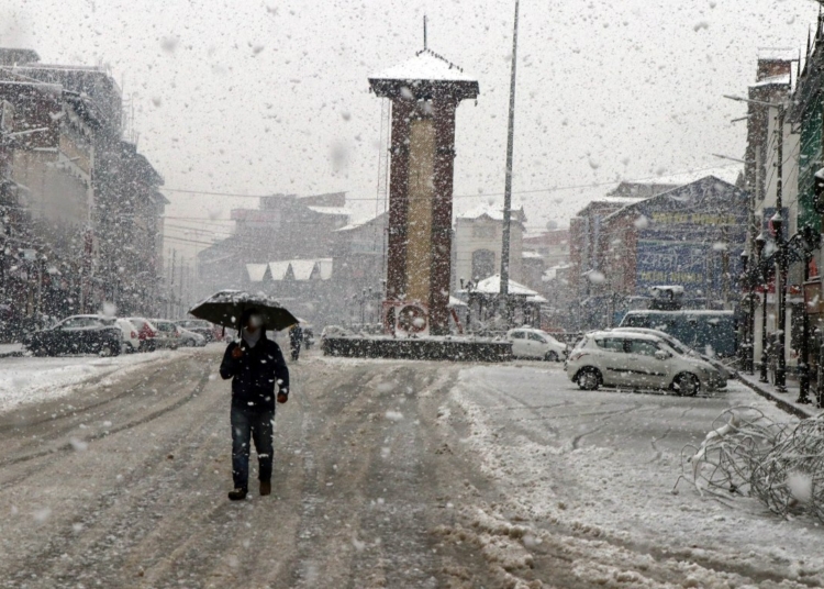 People walking amid snowfall in Srinagar on Thursday November 7, 2019.
PHOTO BY BILAL BAHADUR