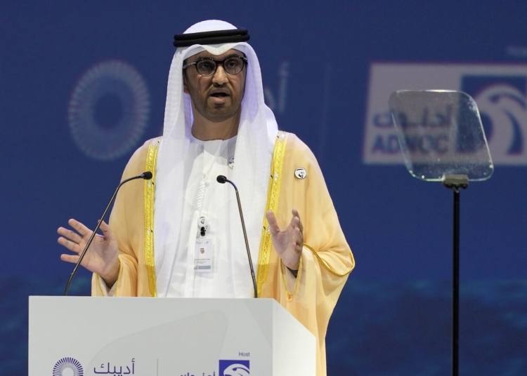 FILE - The Emirati Minister of State and the CEO of Abu Dhabi's state-run Abu Dhabi National Oil Co. Sultan Ahmed al-Jaber talks at the Abu Dhabi International Petroleum Exhibition & Conference in Abu Dhabi, United Arab Emirates, Oct. 31, 2022. (AP Photo/Kamran Jebreili, File)