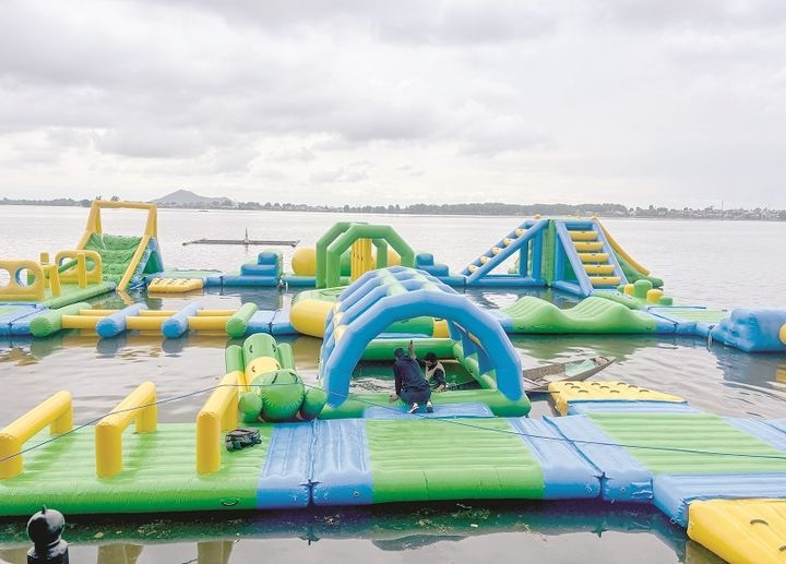 Srinagar, May 05 (ANI): An inflatable Aqua Park has been set up in Dal Lake near Foreshore Road, in Srinagar on Saturday. (ANI Photo)