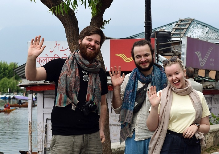Srinagar, April 13 (ANI): Norway tourists enjoy at the banks of Dal lake, in Srinagar on Wednesday. (ANI Photo)